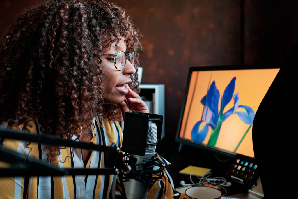 afro female blogger speaking into a professional m 2025 03 09 14 59 31 utc 2D and 3D Animation for Brand Storytelling