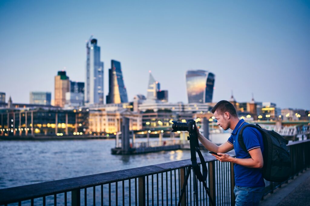 young man photographing with tripod on embankment 2025 02 16 10 53 12 utc Corporate Video Production in Baltimore